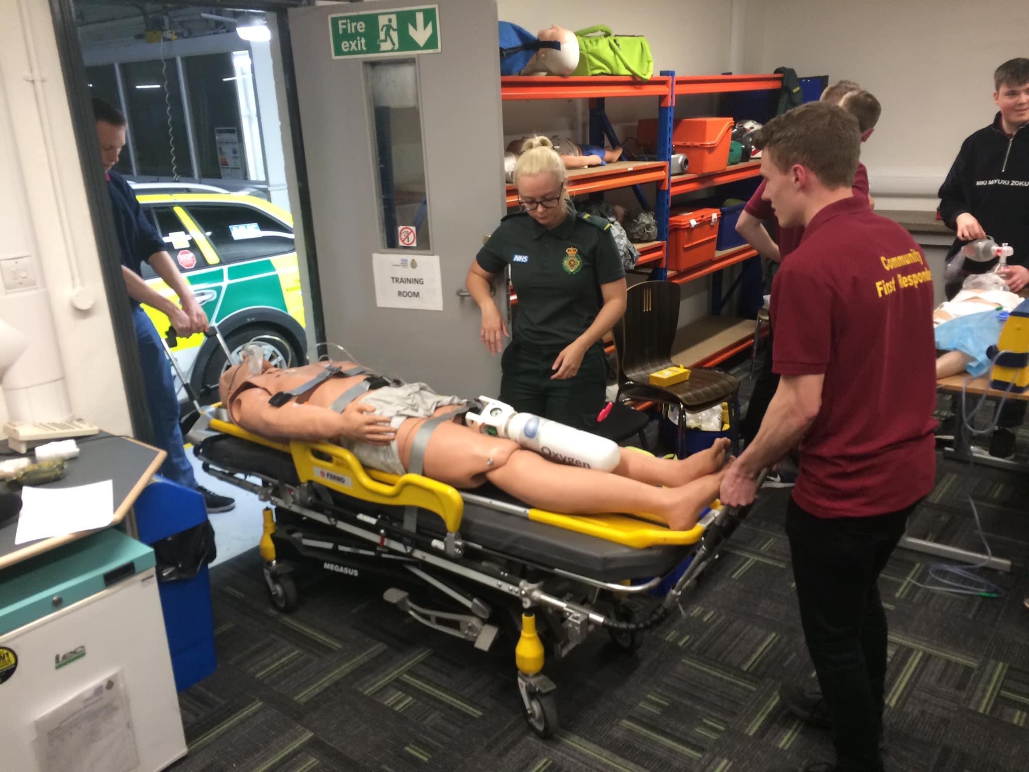 Student volunteers with ambulance equipment