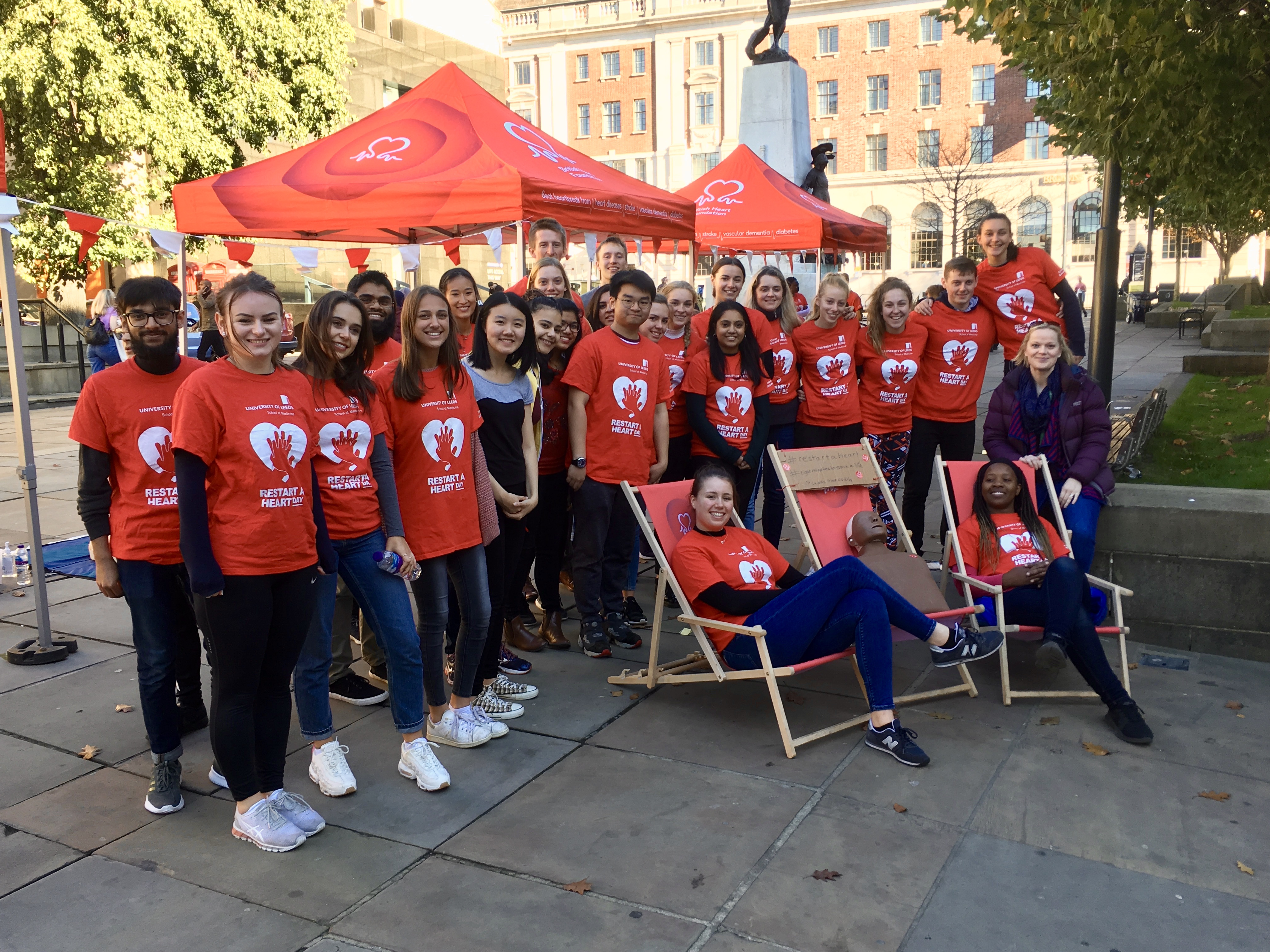 Volunteers promoting Restart a Heart Day with community engagement materials