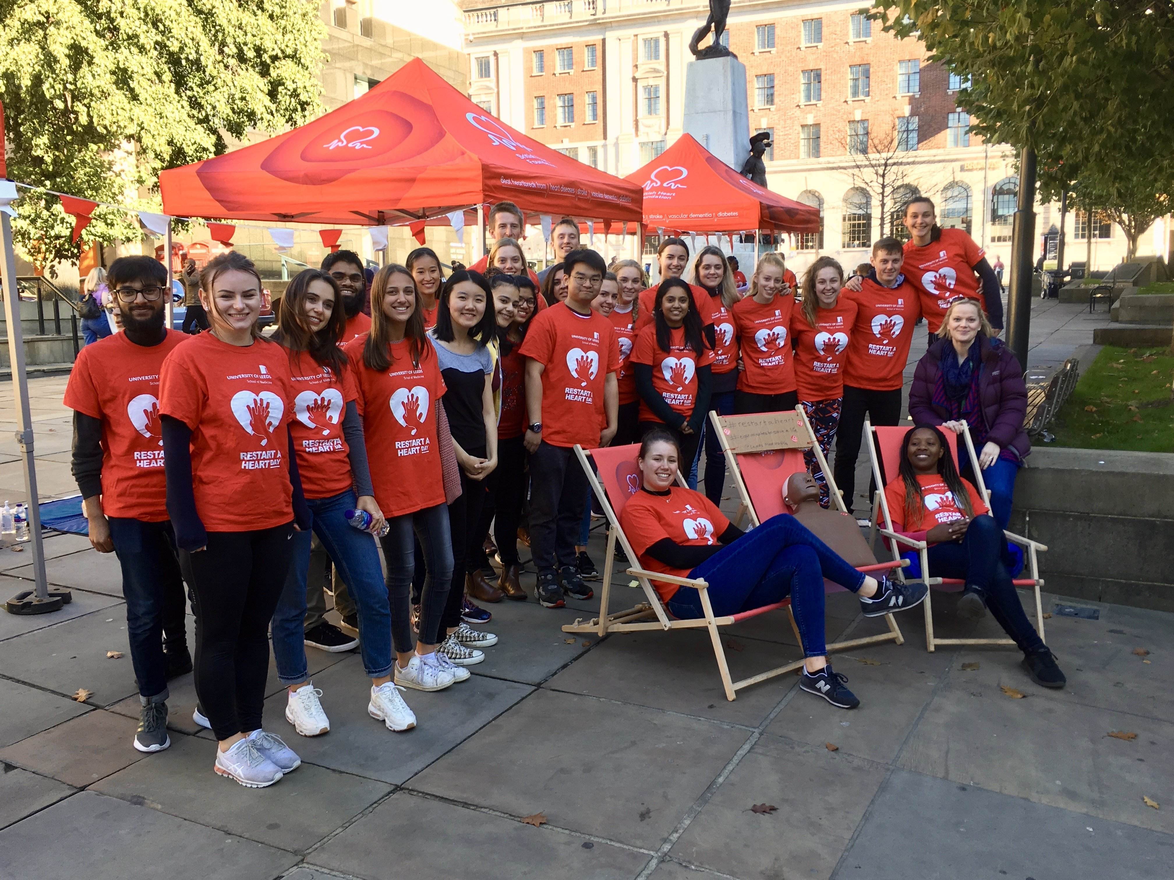 Volunteers promoting Restart a Heart Day with community engagement materials